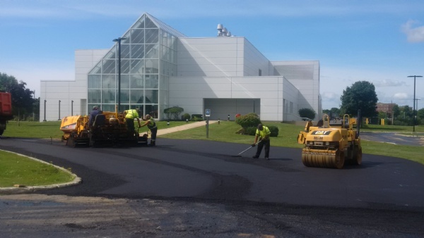 LEVEL & RESURFACE of a commercial parking lot.